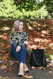 Say 'I love you' in French with our 'Je t'adore' pullover tunic sweater in softest fine gauge cotton.  Feminine and flattering ballet neckline with tubular rib trims and a generous fit.  Choose  Off-White ground with black pattern or  Black ground with off-white pattern.  100% softest cotton Rib trims Fine gauge jacquard Machine wash cold, lay flat to dry.  Je t'adore ladies sweater