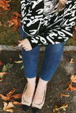Say 'I love you' in French with our 'Je t'adore' pullover tunic sweater in softest fine gauge cotton.  Feminine and flattering ballet neckline with tubular rib trims and a generous fit.  Choose  Off-White ground with black pattern or  Black ground with off-white pattern.  100% softest cotton Rib trims Fine gauge jacquard Machine wash cold, lay flat to dry.  Je t'adore ladies sweater