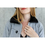 You are pert and pretty in a charming vintage-inspired cardigan. Smooth 100% cotton intarsia embellishes this soft knit, featuring two playful cats reaching for an embroidered butterfly. Accentuated by a detachable FAKE fur trim collar, appliqued elbow patches and delicate pearl buttons, this retro look inspires.  Heather grey with black pattern and collar.  100% cotton Detachable fur collar buttons on/off Appliquéd elbow patches Hand wash or machine wash gentle cycle Front button closure