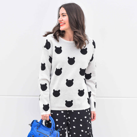 Our best seller is back!  Cats, not dots, adorn our pullover sweater in a soft, fine gauge cotton.  Jewel neckline and long sleeves complete the look.  Mid-hip length.  Choose:    Black ground with Off-white cats or  Off-white ground with black cats.  100% softest cotton Rib trims Fine gauge jacquard Machine wash cold, lay flat to dry.