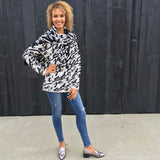 Say 'I love you' in French with our 'Je t'adore' pullover tunic sweater in softest fine gauge cotton.  Feminine and flattering ballet neckline with tubular rib trims and a generous fit.  Choose  Off-White ground with black pattern or  Black ground with off-white pattern.  100% softest cotton Rib trims Fine gauge jacquard Machine wash cold, lay flat to dry.  Je t'adore ladies sweater