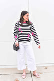 This graphic striped pullover features contrasting pink hearts artfully tossed. 100% soft cotton is in a fine gauge jacquard, suitable for all seasons. Details include jewel neck, long sleeves, and rib trims. Choose: Black/Off-White Stripe has bright pink hearts and neck trim. or Black/Grey Heather Stripe has pale pink hearts and neck trim. 100% softest cotton Rib trims Fine gauge jacquard Machine wash cold, lay flat to dry. Hearts and Stripes sweater